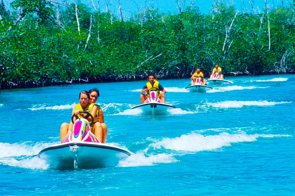 Tourists Drive Motorbikes in Cancun Lagoon Riviera Maya Yucatan - Cheapest Time